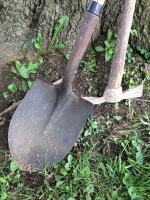 photo of a pick and a shovel.
